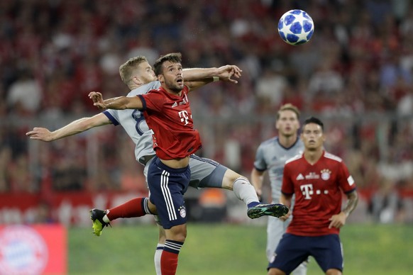 Chicago Fire&#039;s Michael DeLeeuw, background, and Bayern&#039;s Juan Bernat challenge for the ball during a farewell soccer match between FC Bayern Munich and Chicago Fire in Munich, Germany, Tuesd ...