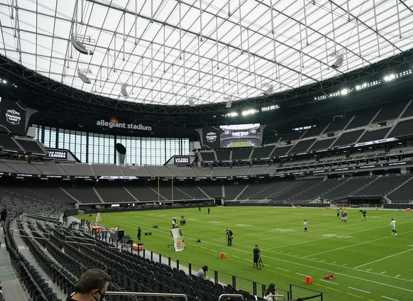 Las Vegas Raiders players train at Allegiant Stadium during an NFL football training camp practice Friday, Aug. 21, 2020, in Las Vegas. (AP Photo/John Locher)