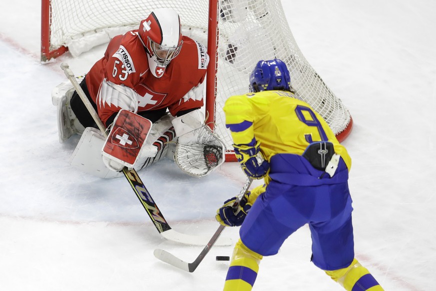 Switzerland&#039;s goalie Leonardo Genoni makes a save against Sweden&#039;s Adrian Kempe during the Ice Hockey World Championships final match between Sweden and Switzerland at the Royal arena in Cop ...