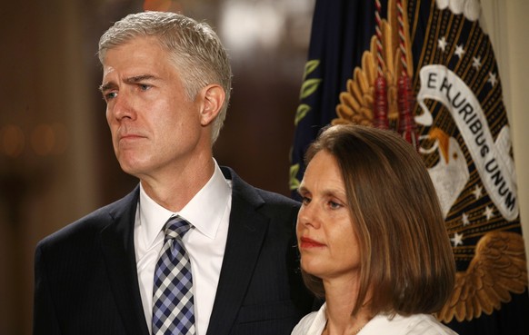 Neil Gorsuch stands with his wife Marie Louise as U.S. President Donald Trump announces his nomination of Gorsuch to be an associate justice of the U.S. Supreme Court at the White House in Washington, ...