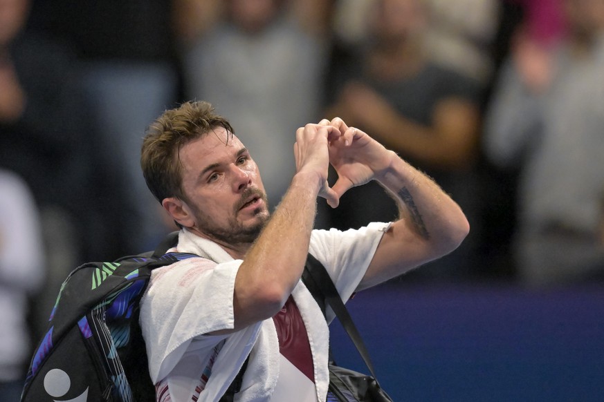 Switzerland&#039;s Stan Wawrinka gestures to the audience after losing his quarter final match against Spain&#039;s Roberto Bautista Agut at the Swiss Indoors tennis tournament at the St. Jakobshalle  ...