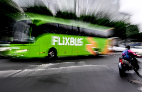 epa06741388 A picture taken with a zoom effect shows a Flixbus bus drives in Dresden, Germany, 16 May 2018. The German bus company is launching its data-driven bus service in the United States, choosi ...