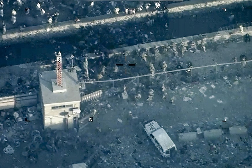 FILE - This image from a video released by the Department of Defense shows U.S. Marines around the scene at Abbey Gate outside Hamid Karzai International Airport on Aug. 26, 2021, in Kabul Afghanistan ...