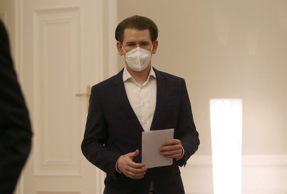 Austrian Chancellor Sebastian Kurz wearing a face mask arrives for a press conference at the federal chancellery in Vienna, Austria, Monday, March 1, 2021. The Austrian government has moved to restric ...