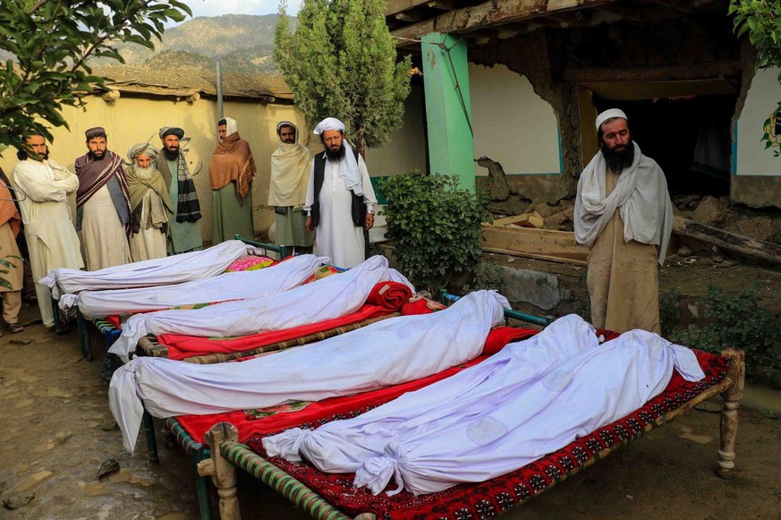 epa10028880 People attend funeral of the victims of earthquake in Gayan village in Paktia province, Afghanistan, 23 June 2022. More than 1,000 people were killed and over 1,500 others injured after a  ...