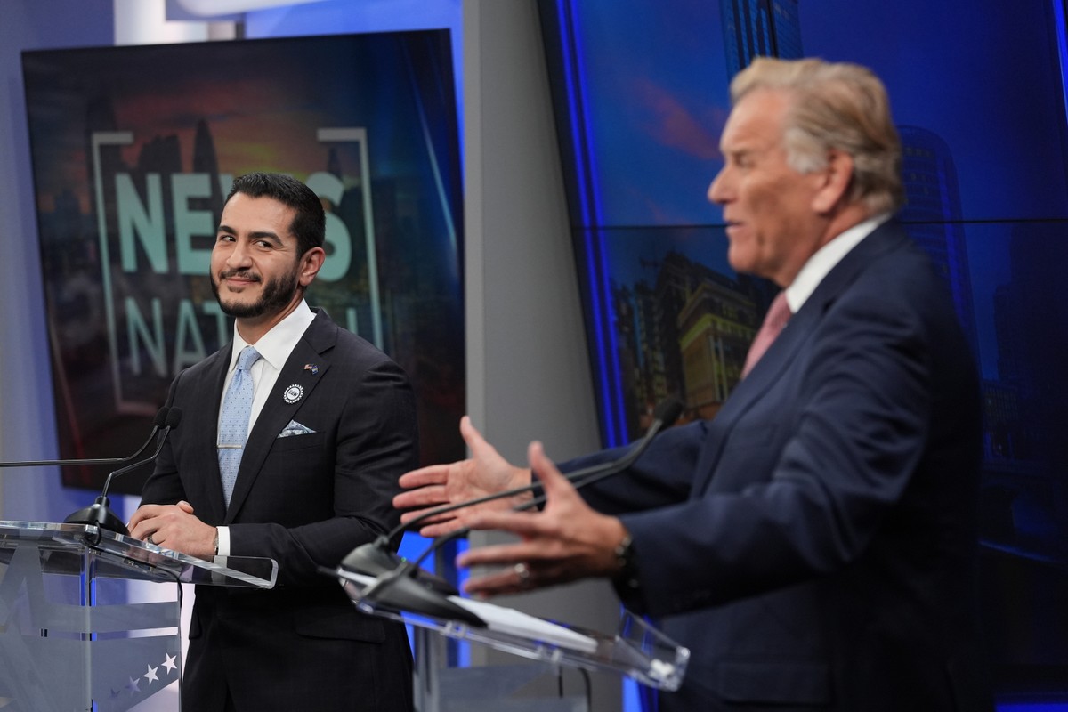 Republican nominee for U.S. Senate Mike Rogers, right, speaks during a televised debate with Democratic nominee for U.S. Senate Abdul El-Sayed, at WOOD-TV, on Thursday, Oct. 8, 2026, in Grand Rapids,  ...