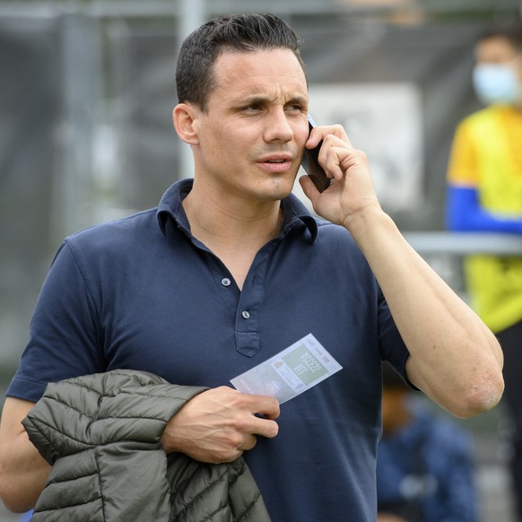 Basel&#039;s director of the board David Degen speaks on his mobile phone during a friendly soccer match as part of the Festival de Football des Alpes between FC Basel 1893 of Switzerland and FC Dynam ...