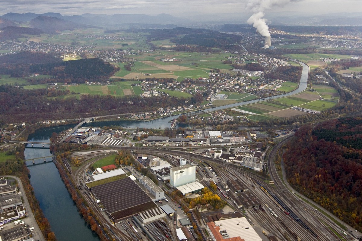View northwards in the direction of nuclear power plant Goesgen across the track field in front of Swiss Federal Railways SBB's industrial plant at the train station in Olten in the canton of Sol ...