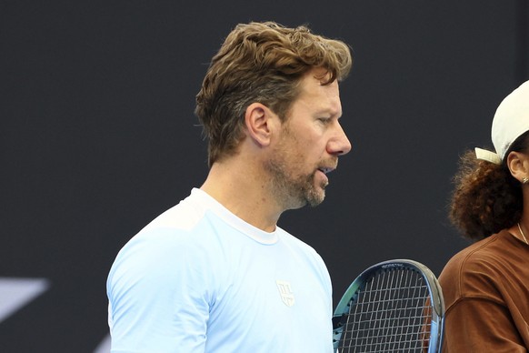 Wim Fissette, left, talks with Naomi Osaka of Japan, not seen, during a training session ahead of the Brisbane International tennis tournament in Brisbane, Australia, Wednesday, Dec. 27, 2023. (AP Pho ...