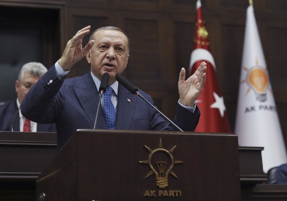 Turkish President Recep Tayyip Erdogan, addresses the members of his ruling party in Parliament, in Ankara, Turkey, Wednesday, March 11, 2020. Erdogan on Wednesday made the incendiary claim that the G ...