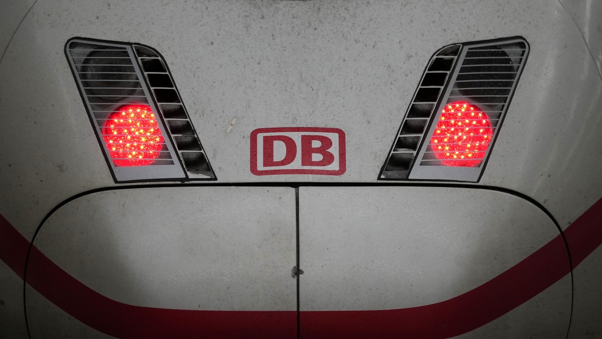 The logo of Deutsche Bahn is fixed on a ICE train at the central station in Munich, Germany, Wednesday, Jan. 24, 2024. Germany's train drivers brought rail traffic to a standstill again early Wed ...
