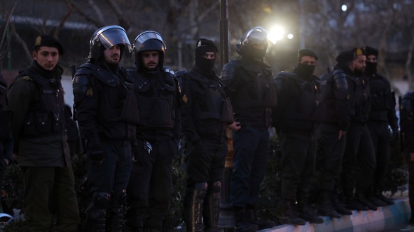 epa12649006 Iranian riot police stand guard as students protest in front of the British embassy in Tehran, Iran, 14 January 2026. Iran is experiencing a nationwide internet blackout that began on 08 J ...