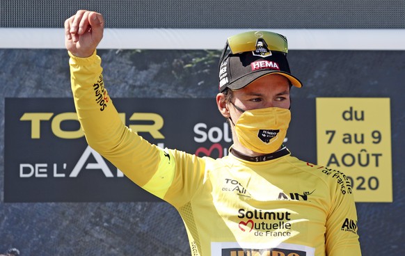 epa08593496 Slovenia Primoz Roglic of team Jumbo-Visma celebrates winning the Tour de l&#039;Ain cycling race at the Grand Colombier, France, 9 August 2020. EPA/GUILLAUME HORCAJUELO