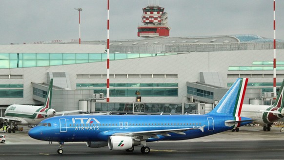 epa09655921 A view of the first ITA Airways aircraft in the new blue livery prior to takeoff from Rome Fiumicino Airport to Milan, Italy, December 24, 2021. ITA Airways flight AZ 2044 is operated with…