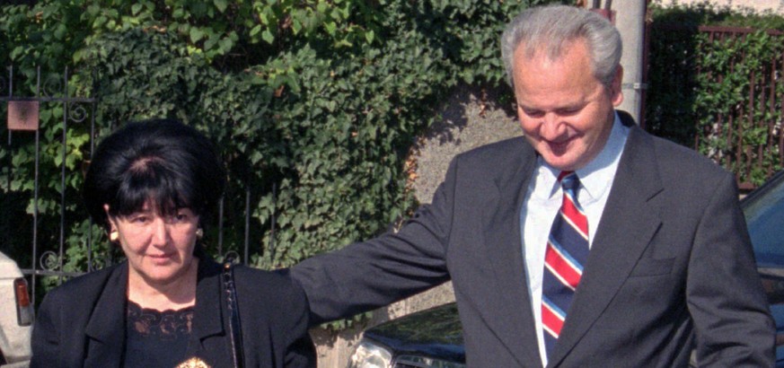 File - In this Sunday, Nov. 3, 1996 file photo, Serbian President Slobodan Milosevic, right, walks with his wife Mirjana Markovic towards the polling station. Serbia’s state television said that Mirja ...
