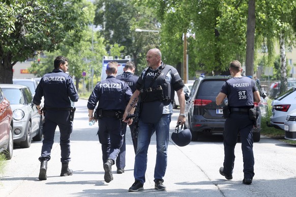 Police officers attend the scene of a shooting at a school in Graz, Austria, Tuesday, June 10, 2025. (Kleine Zeitung via AP)
Austria School Police