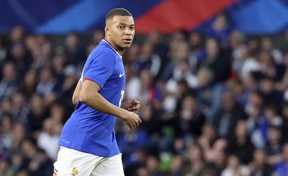 epa11392220 Kylian Mbappe of France looks on during the international friendly soccer match between France and Luxembourg, Metz, France, 05 June 2024. EPA/CHRISTOPHER NEUNDORF