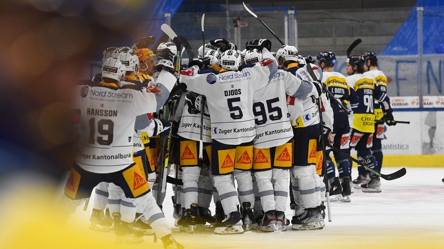 Zug&#039;s players celebrate the 2-3 victory at the end of the match, during the match of National League A (NLA) Swiss Championship 2021/22 between HC Ambri Piotta and EV Zug at the ice stadium Gotta ...