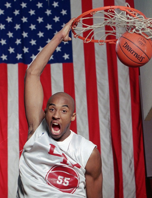 FILE - In this Jan. 19, 1996 file photo Kobe Bryant dunks the ball at his Lower Merion, Pa. high school gym during a practice. Bryant, a five-time NBA champion and a two-time Olympic gold medalist, di ...