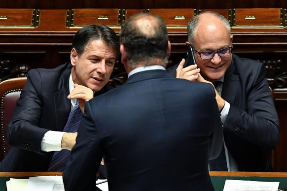epa07830836 Italian premier Giuseppe Conte (L) and Economy Minister Roberto Gualtieri (R) in the Lower House during a confidence vote, in Rome, Italy, 09 September 2019. Italian Premier Giuseppe Conte ...