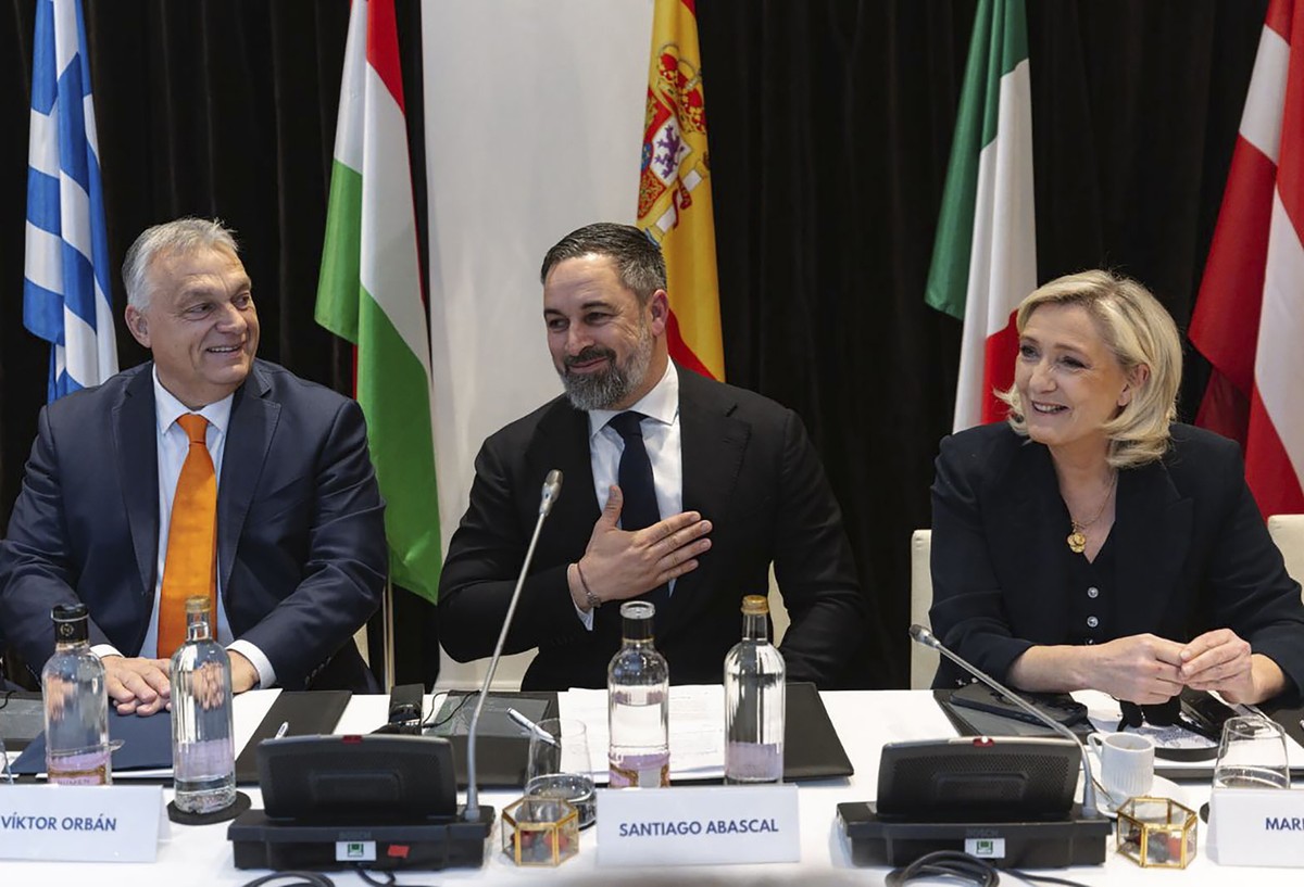 epa11881529 A handout photo made available by European Patriots Party shows VOX and Patriots' president Santiago Abascal (C) welcoming Hungarian Prime Minister Viktor Orban (L), the president of  ...