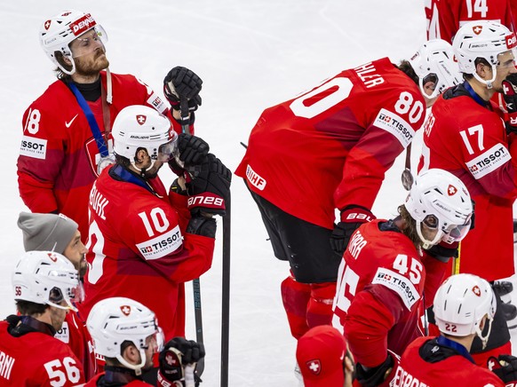 epa12135781 Switerland's players react after losing the gold medal game between Switzerland and USA at the IIHF 2025 World Championship, at the Avicii Arena (Globe), in Stockholm, Sweden, 25 May  ...