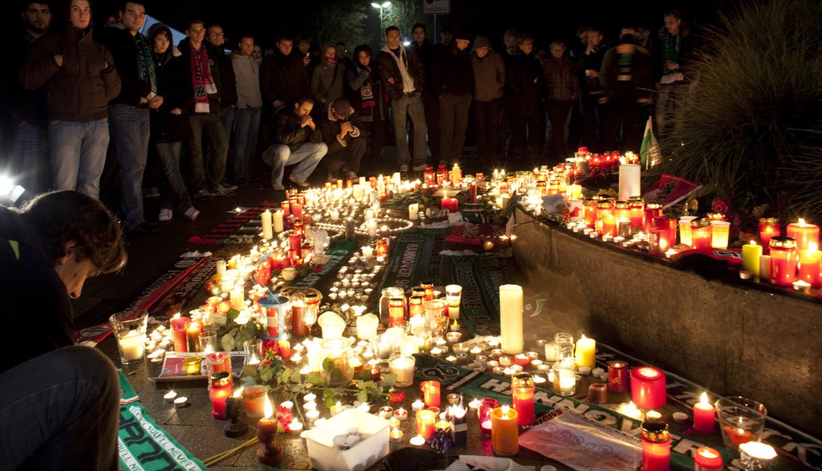 Hundreds of supporters mourn in front of a soccer stadium in Hanover, northern Germany, early Wednesday, Nov. 11, 2009. Robert Enke, the Hanover 96 and Germany's national team goalkeeper, killed  ...