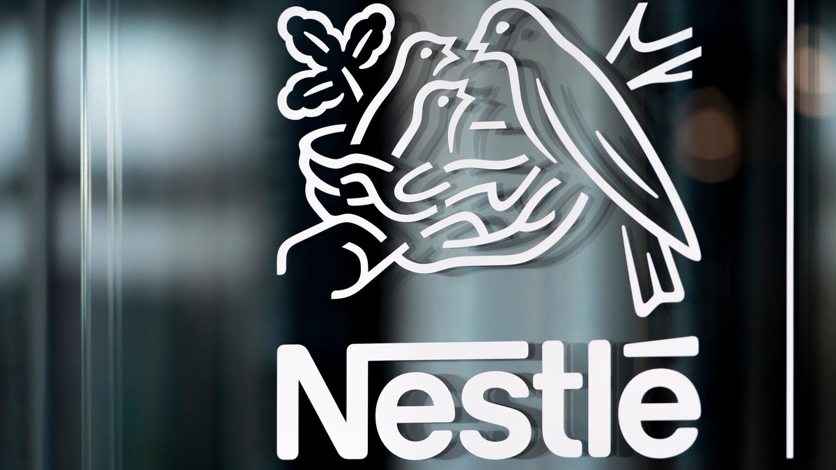 FILE - In this Thursday, Feb. 14, 2019, file photo, Nestle's logo is displayed on a window, during the 2018 full-year results press conference of the food and drinks giant Nestle, in Vevey. (Laur ...