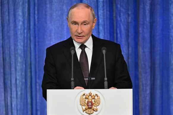 Russian President Vladimir Putin delivers his speech at the gala marking the National Guard Day at the State Kremlin Palace in Moscow, Friday, March 27, 2026. (Sergey Bobylev, Sputnik, Kremlin Pool Ph ...