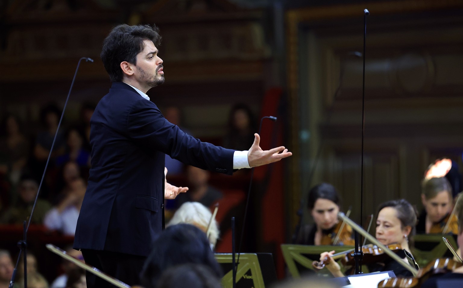 epa12355398 Israeli conductor Lahav Shani (L) performs with the Rotterdam Philharmonic Orchestra the Symphony No. 3 in E flat major, Op. 55, Eroica, of Ludwig van Beethoven, on stage at the Romanian A ...