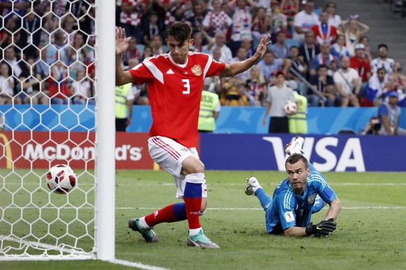 epa06872398 Goalkeeper Igor Akinfeev of Russia (R) looks on as a shot of Ivan Perisic of Croatia (unseen) hits the post during the FIFA World Cup 2018 quarter final soccer match between Russia and Cro ...