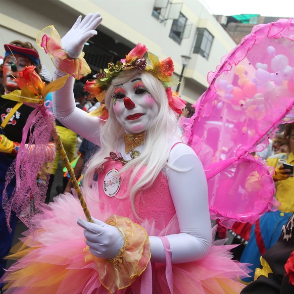 epa05990442 Clowns march through the streets of the historic center of Lima, Peru, 25 May 2017. Hundreds of Clowns took part in a demonstration in Lima to ask Congress to officially recognize 25 May as Clown Day. EPA/Ernesto Arias