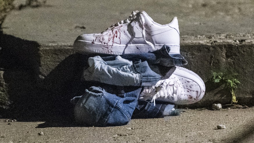 In this Aug. 5, 2018 photo, blood covered clothing sits at the scene where a man was shot in Chicago. Police Superintendent Eddie Johnson plans to discuss the weekend violence during a Monday news con ...