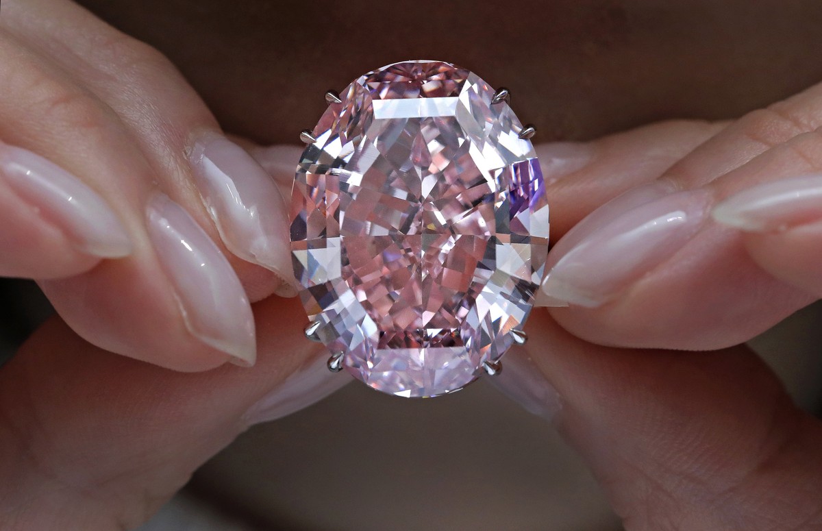 The Pink Star diamond, the most valuable cut diamond ever offered at auction, is displayed by a model at a Sotheby's auction room in Hong Kong, Wednesday, March 29, 2017. It is the largest intern ...