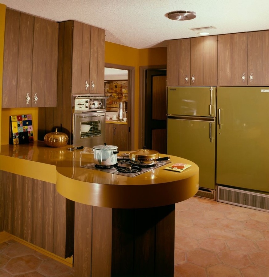 1. August 1963 - Peninsular cooking counter jutting out into kitchen decorated in antique gold and bronze green, including cabinets finished in green with porcelain knobs. (Photo by Tom Leonard/Conde  ...
