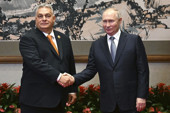 FILE - Russian President Vladimir Putin, right, and Hungarian Prime Minister Viktor Orban pose for a photo prior to their talks on the sidelines of the Belt and Road Forum in Beijing, China, on Tuesda ...