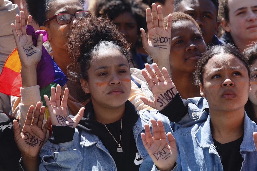 High school students call for anti-gun laws as they protest and rally in Washington Square Park, Friday April 20, 2018 in New York. Protests were held across the country Friday, on the 19th anniversar ...