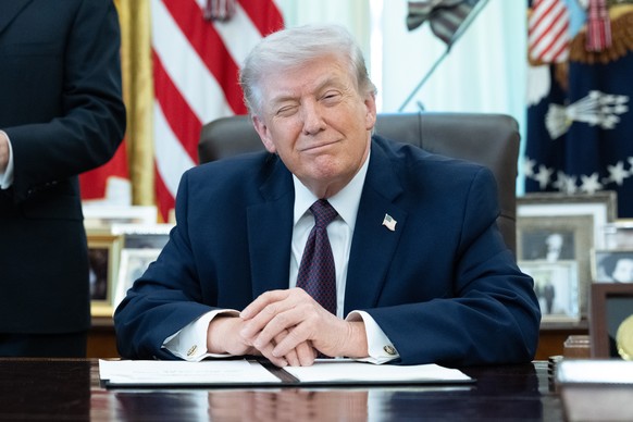 epa12863111 US President Donald J Trump gestures during an executive order signing event in the Oval Office of the White House in Washington, DC, USA, 31 March 2026. The order directs the federal gove ...