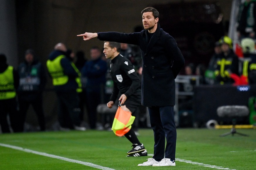epa10527463 Head coach Xabi Alonso of Bayer Leverkusen reacts during the soccer Europa League round of 16 second leg soccer match Ferencvaros vs. Bayer Leverkusen in Puskas Ferenc Arena in Budapest, H ...