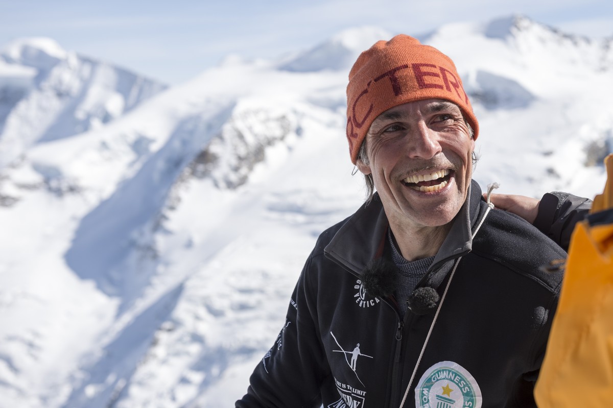 Swiss tightrope artist Freddy Nock reacts after walking on a rope between the Biancograt ridge and Piz Prievlus, in Pontresina in Graubuenden, eastern Switzerland, on Friday, March 20th, 2015. He cove ...