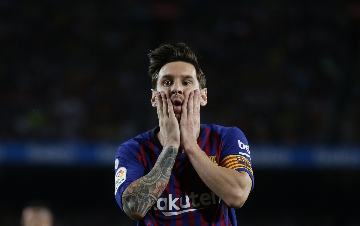 FC Barcelona's Lionel Messi reacts after missing an opportunity during the Spanish La Liga soccer match between FC Barcelona and Girona at the Camp Nou stadium in Barcelona, Spain, Sunday, Sept.  ...