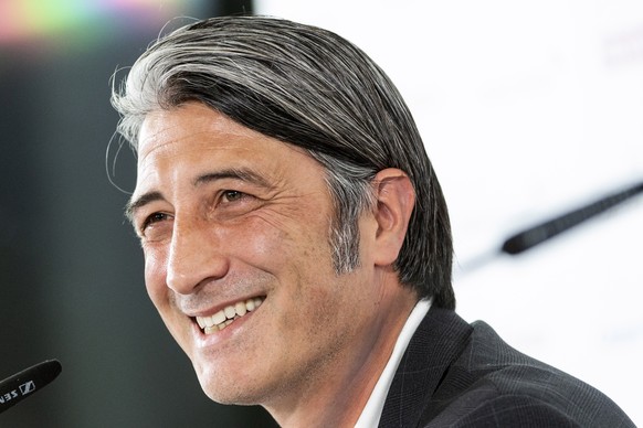epa09407318 Swiss soccer coach Murat Yakin smiles at a press conference where he is presented as the new coach of Switzerland's national team in Muri, Switzerland, 09 August 2021. EPA/Alessandro ...