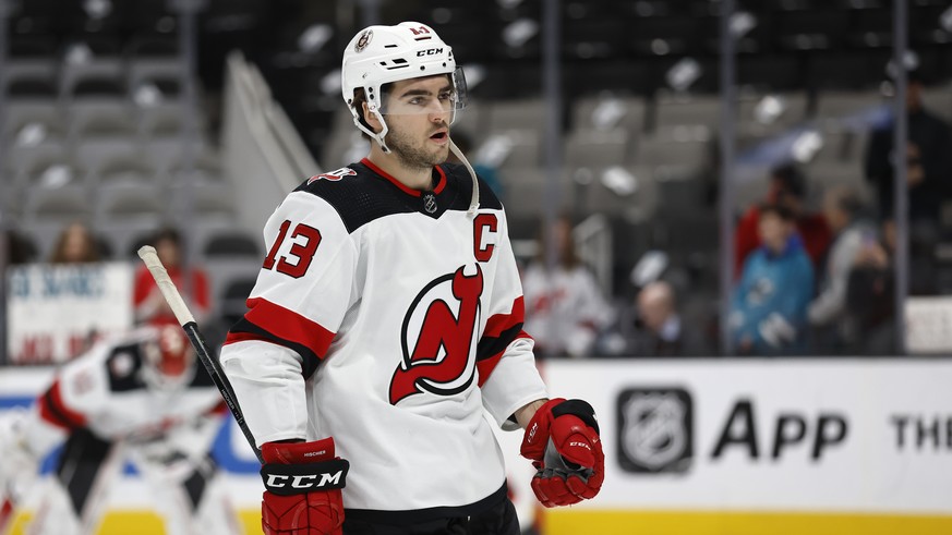 New Jersey Devils center Nico Hischier (13) skates during warmups before an NHL hockey game against the San Jose Sharks on Monday, Jan. 16, 2023, in San Jose, Calif. (AP Photo/Josie Lepe)