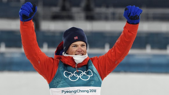 epa06521366 Johannes Hoesflot Klaebo of Norway celebrates after he wins the gold in the the Men&#039;s Cross Country Sprint Classic Final at the Alpensia Cross Country Centre during the PyeongChang 20 ...