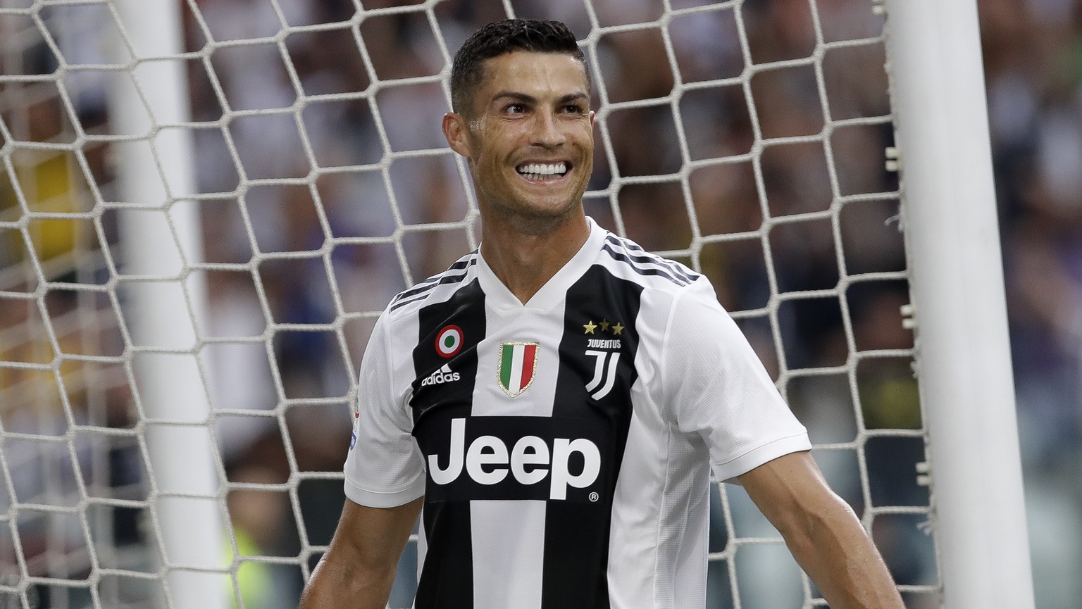 Juventus&#039; Cristiano Ronaldo smiles after his teammate Juventus&#039; Mario Mandzukic scored his sides second gaol of the game during the Serie A soccer match between Juventus and Lazio at the All ...