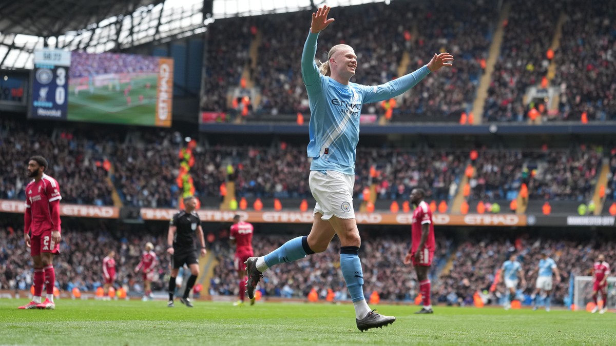 Manchester City's Erling Haaland celebrates after scoring his third goal during the FA Cup quarter-final soccer match between Manchester City and Liverpool in Manchester, England, Saturday, April ...