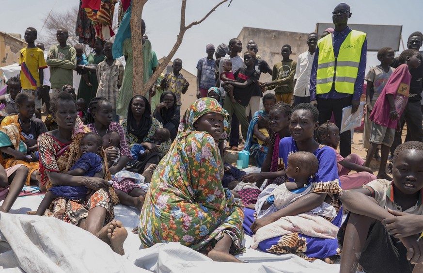 FILE - South Sudanese who fled from Sudan sit outside a nutrition clinic at a transit center in Renk, South Sudan, May 16, 2023. The U.N. migration agency says Sudan?s conflict has displaced more than ...
