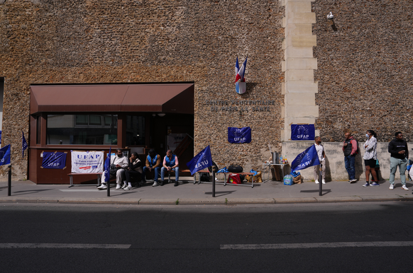 Penitentiary workers gather during a protest against prison overcrowding and understaffing, outside the Sante prison in Paris, Monday, April 27, 2026. (AP Photo/Aurelien Morissard)
