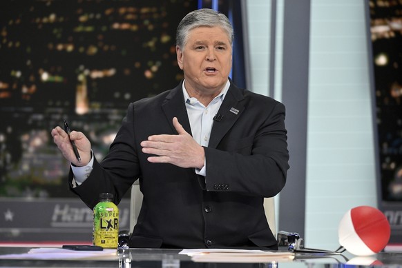 FILE- Fox News commentator Sean Hannity speaks during an interview at Fox News Studios, March 16, 2023, in New York. Dominion Voting Systems&#039; defamation lawsuit against Fox News for airing bogus  ...