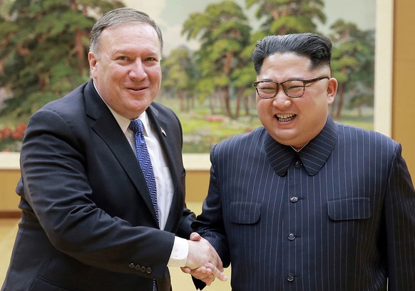 In this Wednesday, May 9, 2018, file photo provided by the North Korean government, U.S. Secretary of State Mike Pompeo, left, shakes hands with North Korean leader Kim Jong Un during a meeting at Wor ...